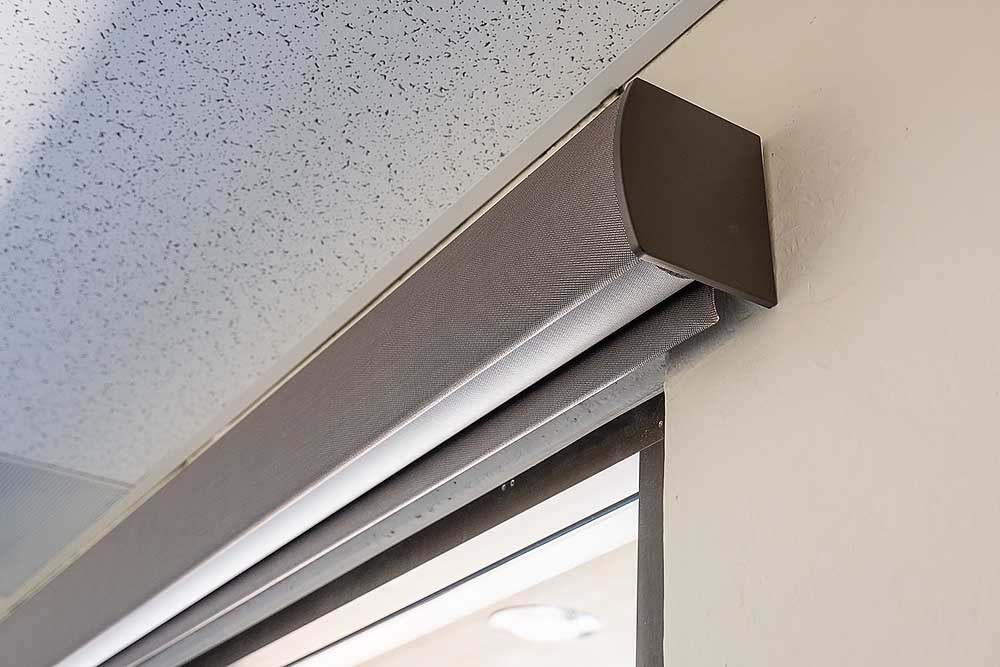 shades-pocketed-1000px – SoundVision Lutron motorized shades fully raised into a pocketed cover