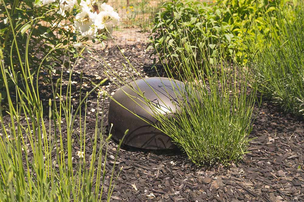 Garden Series Subwoofer hidden in the outdoor garden area