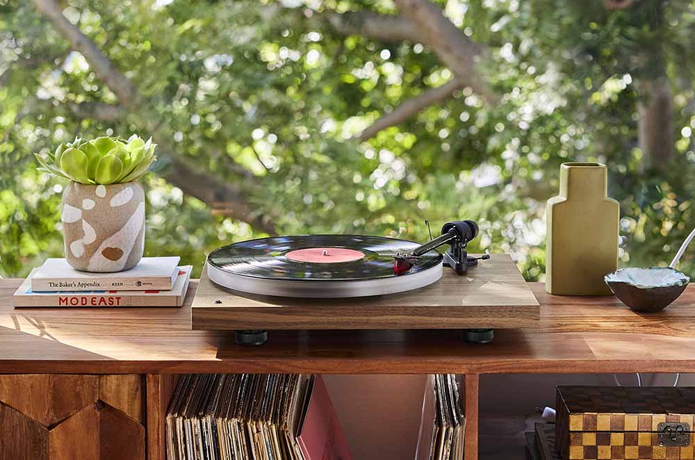 Vinyl Turntable on a shelf against a window