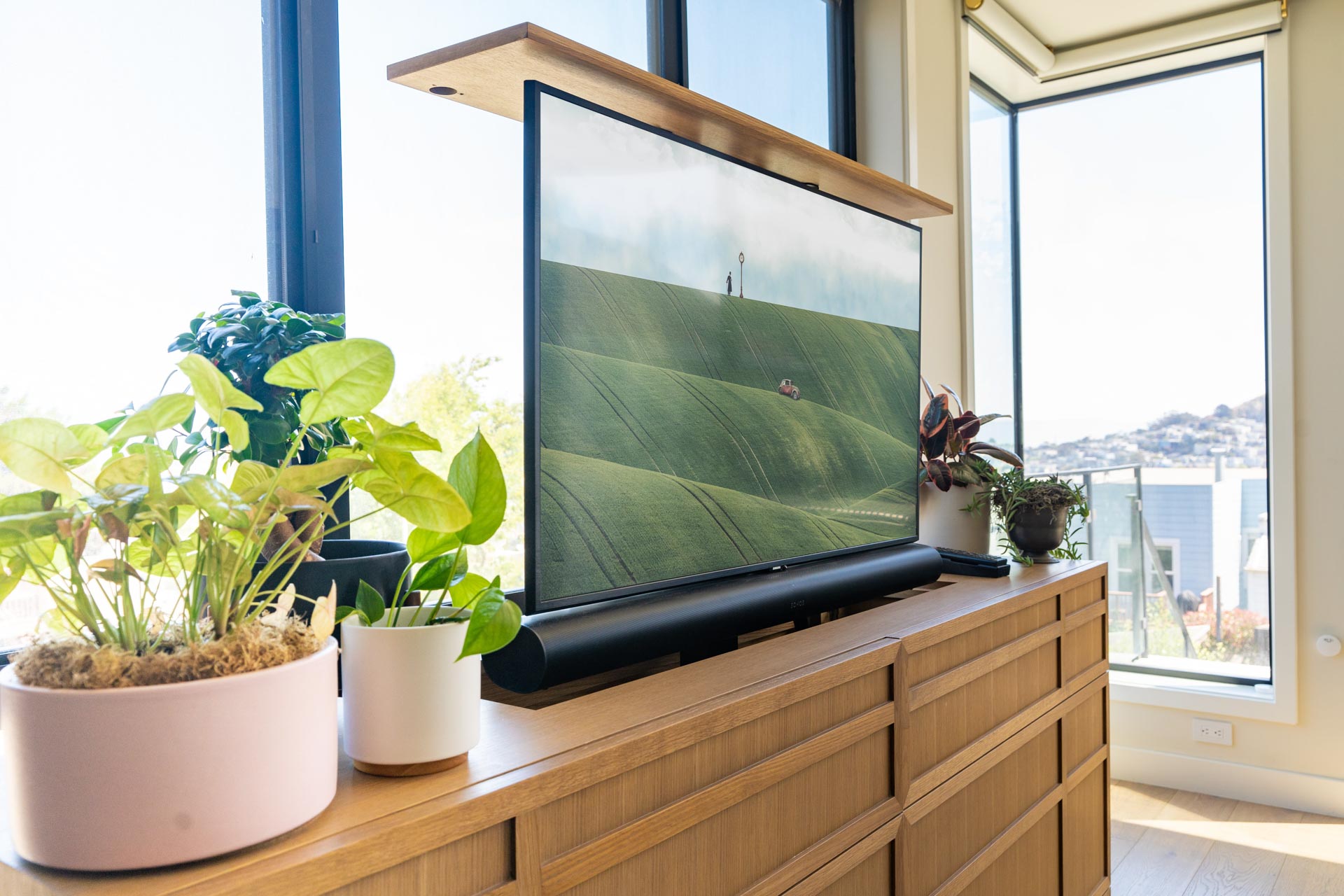 Raised 49" Samsung 4K TV on a Nexus L-50 Motorized Lift to raise the TV out of a custom cabinet with a Sonos Arc Sound bar