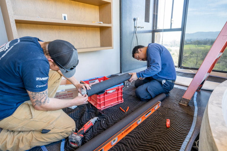 SoundVision Employees Assembling a Lutron Shade