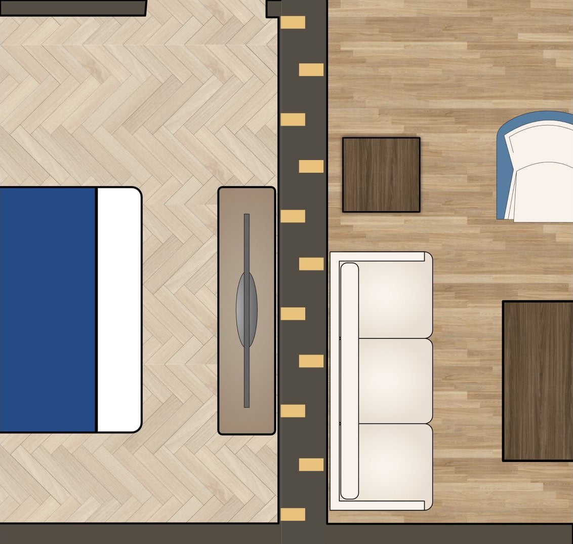 Top-down view inside a wall with staggered studs, where two neighboring rooms each get their own set of studs, but one room is staggered so it can be more condensed packaged.